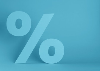 Sale concept. Percent sign on a blue background