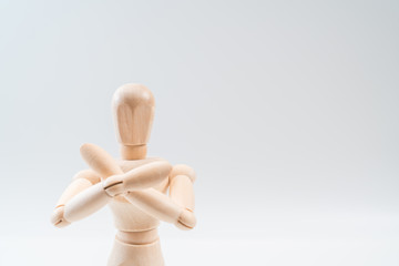 Refusal gesture, Wooden dummy, crossed hands on white background, copy space for your object or text