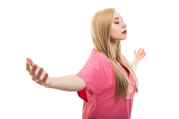 Portrait of female nurse wearing scrubs making winner gesture