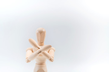Refusal gesture, Wooden dummy, crossed hands on white background, copy space for your object or text