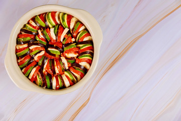 Uncooked french vegaterian food ratatouille on white background.