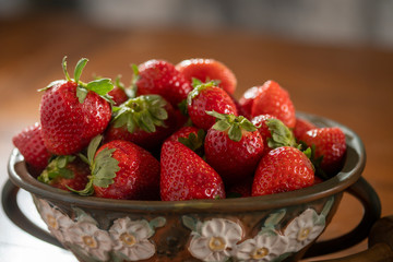 Still Life of Strawberries in clay vessel