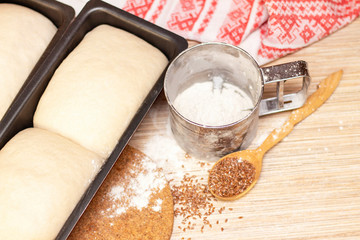 Making bread. the dough is in the mold for bread.