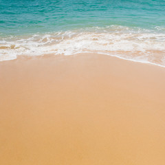 Fototapeta na wymiar Soft blue ocean wave on sandy beach.