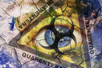 Coronavirus global Pandemic outbreak and quarantine concept. Creative composite of of woman face with cracked World map painted, and biohazard symbol, with the text Quarantane in Portuguese language