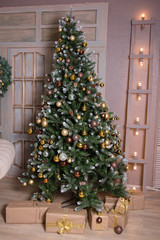 Artificial Christmas tree with balls. New Year's decor. Christmas tree. Gifts 