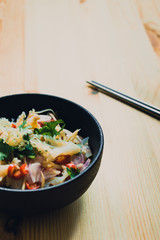 Jelly fish hot spicy and sour salad on wooden table, Thai food thai style.
