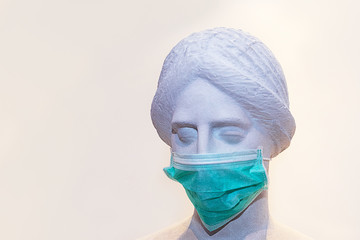 Head of sculpture of an antique woman in protective mask for anti-infection from respiratory sick. Outbreak of coronavirus concept.