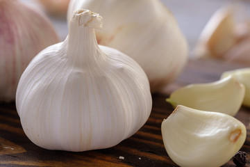 Healthy and wholesome food. Fresh garlic on a wooden table