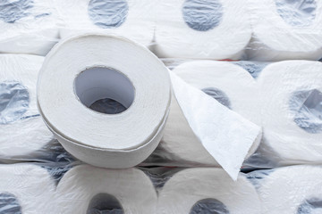 Background of toilet paper rolls in a package. Top view.