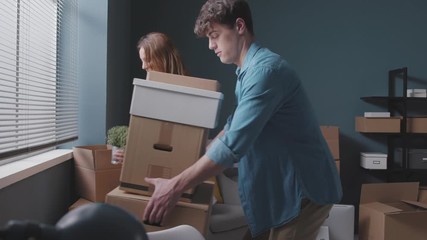Happy young couple moving in their new home - Powered by Adobe