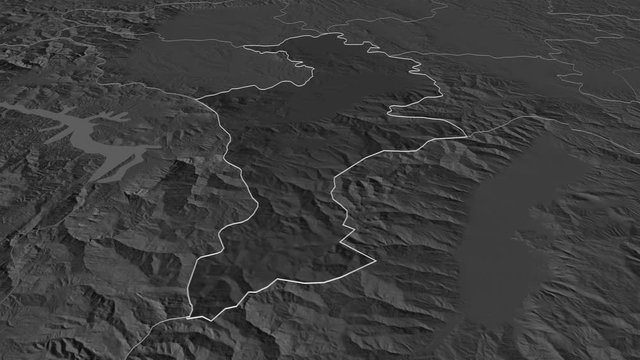 Prizren, district with its capital, zoomed and extruded on the bilevel map of Kosovo in the conformal Stereographic projection. Animation 3D