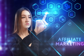 Business, Technology, Internet and network concept. Young businessman working on a virtual screen of the future and sees the inscription: Affiliate marketing