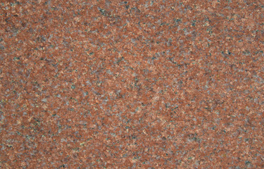 Texture red granite with small crystals and splashes. Background from a cut of stone, excellent...