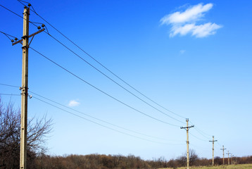 Power pole stands in the field.