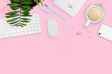 Flat layout of woman workplace. Cute accessories on pink background