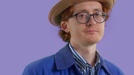 New fluid identity male portrait redhead authentic man in glasses wears a vintage clothes, hat 