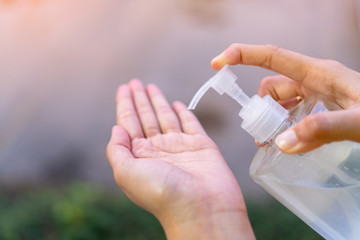  Washing your hand by alcohol sanitizer gel pump dispenser for protecting infection from a Covid-19 virus or Coronavirus infection and killing germs other viruses.Hygiene and Healthcare concept.