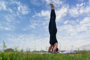 Healthy woman practicing yoga in morning the outdoor nature. Woman exercising pose vital and meditation for fitness lifestyle
