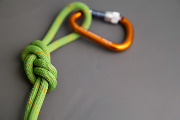 locking carabiner clipped to rope tied in figure eight