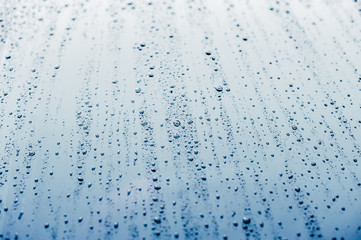 Close up of water drops on background. Abstarct  texture with bubbles on window glass surface. Raindrop, Realistic pure water droplets condensed for creative banner design