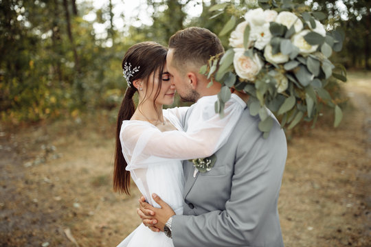 Stunning wedding couple in the summer forest