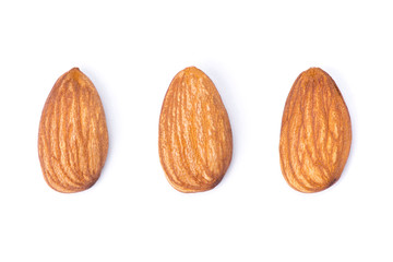 Closeup almond nuts isolated on white background. Top view. Flat lay.