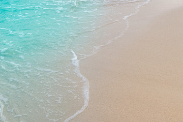 Soft wave of blue sea and sand on summer holidays beautiful beach, Background, Travel concept, Selective focus...