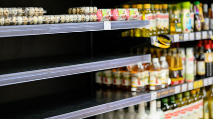 Empty egg shelves in a grocery store or supermarket. Hoarding food due to Coronavirus outbreak....