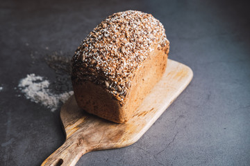 Rustic loaf of bread with seeds as chia and sunflower.
