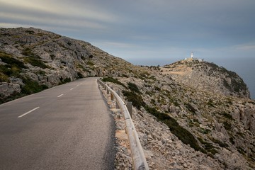 Cap De Formentor Lighthouse with winding road and railing, near Pollenca and Alcudia, Mallorca, Spain.