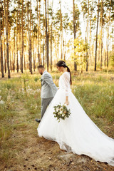 Tender wedding couple near the lake