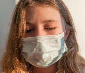 A girl in medical mask