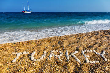 Turkey sign on the beach made from small rocks. Vacations concept