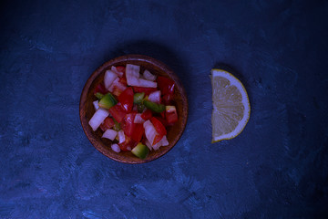 Argentinian salsa criolla with a lemon