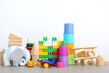 Set of different children's toys on a colored background. A place to insert text, minimalism. Baby background.