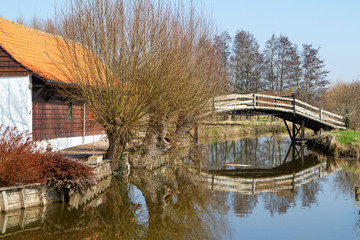  wooden bridge over the river giving access to the house