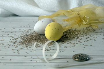 Yellow and white easter egg spilled from yellow bag