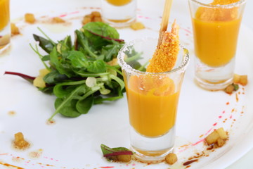 Shrimp in breadcrumbs with mango sauce on a white plate