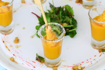 Shrimp in breadcrumbs with mango sauce on a white plate