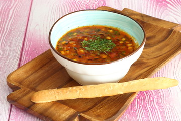 Thai soup with grissini on white background
