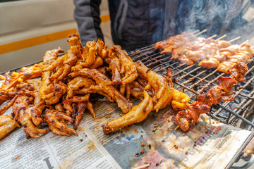 Fototapeta premium South African street food - barbecued chicken skewers and feet
