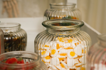 Candy sweets jar on a dessert table at party or wedding celebration