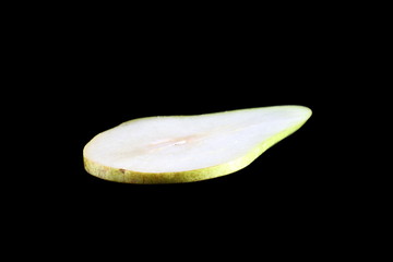 A piece of pear on a black background