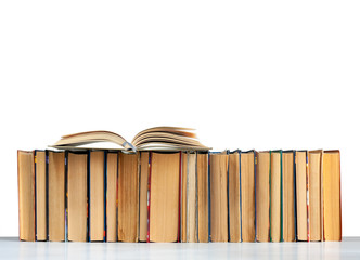 Stack of books and open book isolated on a white background, back to school education concept.