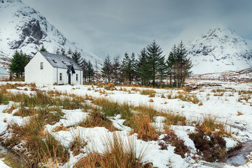 A remote mountain cottage in the snow at Glencoe