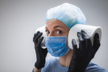 Coronavirus COVID-19 hysteria with toilet paper / illustrative presentation about real panic stockpiling.