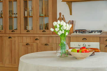 The interior of the kitchen in a rustic style, Scandinavian style. Wooden facades of cabinets.