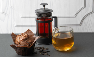 tea with dessert on the black table