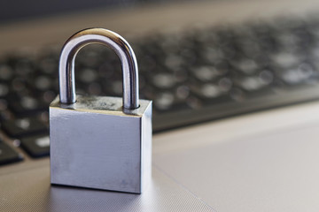 Fototapeta premium closed metal lock on a computer